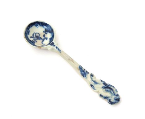 A Worcester blue and white mustard spoon, c.1770, with rounded bowl and elaborate scroll handle, the bowl with a simple flowe