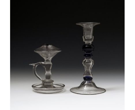 A Continental glass candlestick, 19th century, the stem with multiple knops in clear and blue glass, raised on a conical foot
