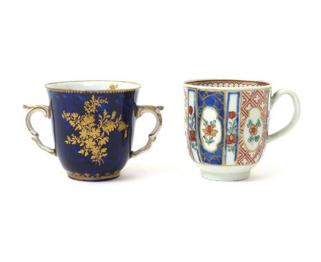 A Chelsea-Derby two-handled cup, c.1770, decorated with a large spray of gilded flowers and small scattered insects on a deep