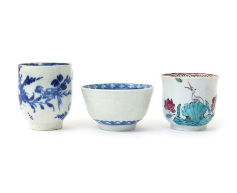 Two Liverpool coffee cups, c.1760-70, one enamelled with two white egrets behind and above a large lotus spray, the other in 