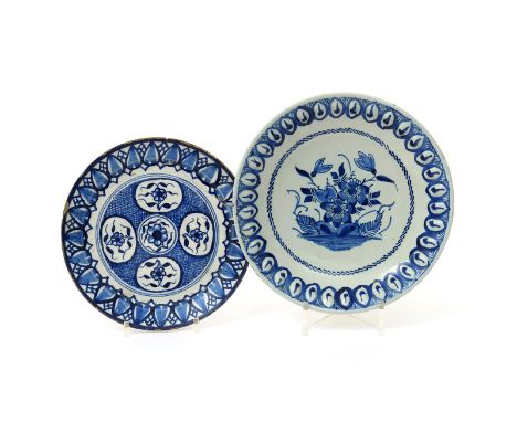 Two London delftware plates, c.1700-20, the smaller Vauxhall and painted in blue with floral panels reserved on a hatched gro