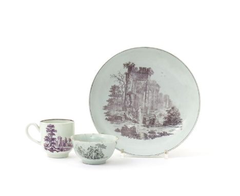 A Worcester saucer dish, c.1775, printed in black with a figure standing amidst Classical ruins, a coffee cup printed in purp