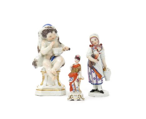 A Meissen figure of Winter, c.1760, modelled as a boy wearing a fur-lined cloak and holding a pan of hot coals on one knee, r