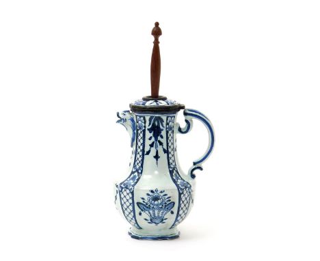A French faïence chocolate pot, late 18th century, the lobed form painted in blue with baskets of flowers between narrow diap