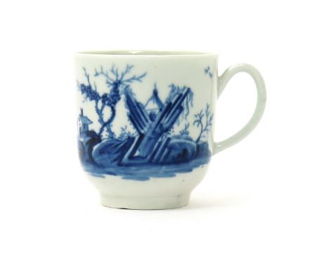 A Worcester blue and white coffee cup, c.1758, painted in the Gazebo pattern with a small pagoda peeping between jagged, fork