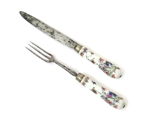 A pair of French porcelain cutlery handles, mid 18th century, of flattened oval form, painted in the Oriental style with leaf