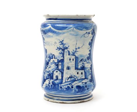 A large Naples maiolica albarello, dated 1714, the tall waisted form painted with European buildings in a village landscape, 