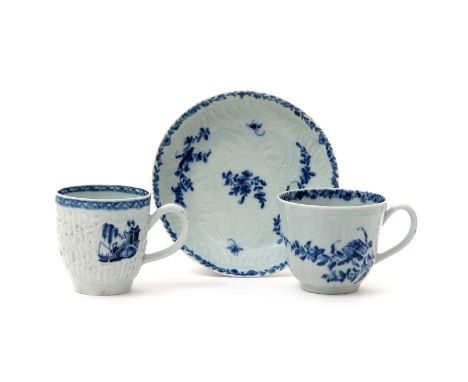 A Worcester blue and white coffee cup and saucer, c.1758, decorated with the Feather Mould Floral pattern, workman's marks, a