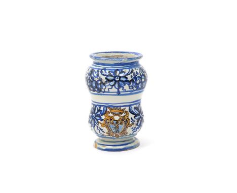 A Deruta maiolica small albarello or pill jar, c.1700, the waisted body with a blank cartouche between bold floral swags in b
