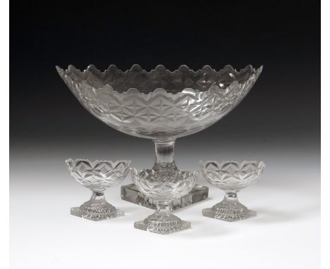 An Irish cut glass centrepiece and three salts, early 19th century, of navette shape, cut to the shaped rim with a band of st