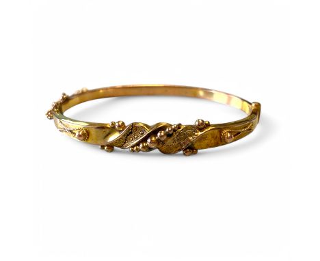 A 9ct yellow gold hollow bangle (repaired), 62mm by 55mm by 8mm external, approximately 5.9g.
