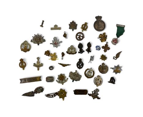 A collection of various military badges and buttons numerous examples including Army, Navy, New Zealand, Irish harp, Gloucest