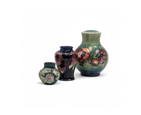 Three items of Moorcroft pottery, comprising an Anemone pattern lamp base, a Pansy pattern shouldered vase and a small Leices