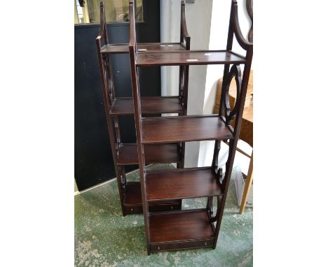 A pair of modern mahogany shelf units, four shelves, single drawer to base.