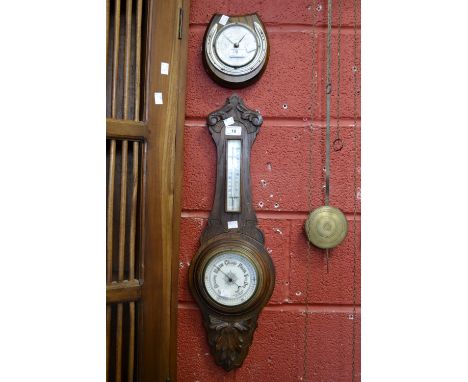 An oak cased Aneroid barometer with thermometer; an Art Deco style barometer, horseshoe mounted