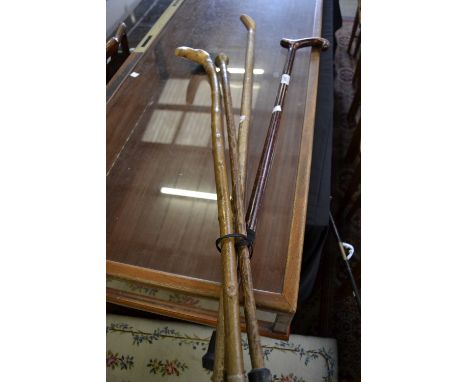 A 19th century gentleman's brass-mounted bamboo walking stick; others (4) 