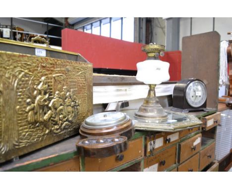 A Smiths Bakelite mantel clock; an oak wall barometer; a Duplex oil lamp; an octagonal brass framed wall mirror