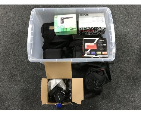 Two crates of assorted digital cameras, JVC video cam, camera bags etc 