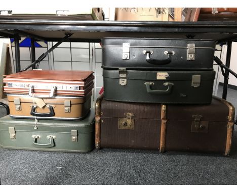 An early 20th century wooden bound trunk, four vintage cases and a briefcase 