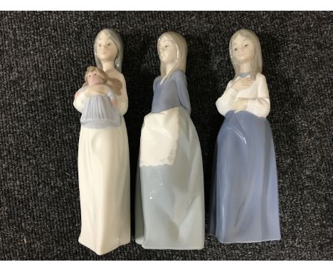 Three Nao figures of girls