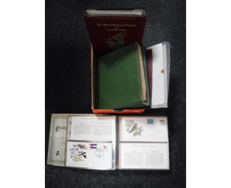 A box of three albums of American Song Birds flowers first day covers, Postal Commemorative Society folio, Apollo 11 Commemor