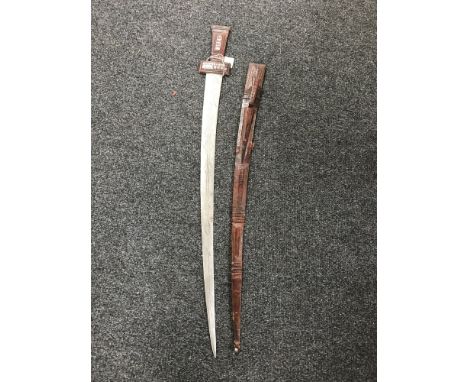 An Eastern leather handled sword in scabbard