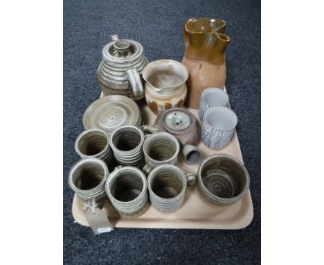 A tray of fourteen piece pottery tea service, pottery sake cups, two pottery jugs 