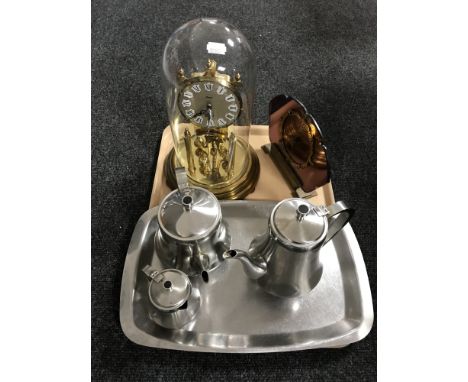 A tray of three piece steel tea service on tray, Art Deco style mirrored mantle clock, Kundo anniversary clock under shade 