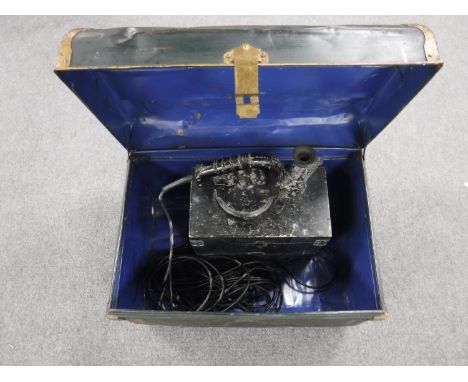 A tin trunk containing an Aldis lamp in box 