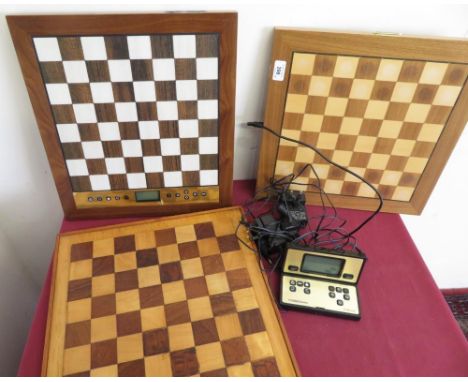 Millennium, The King Performance Electronic chessboard and a similar Chess Genius Exclusive chessboard and a wooden chessboar