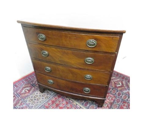 A small early 20th C mahogany bow front chest with four long drawers on bracket feet (W70cm x D43cm x H74cm) 