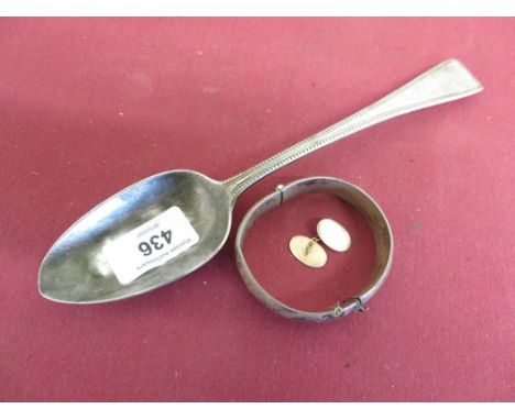 9ct gold Hallmarked single oval cufflink, hallmarked old English tablespoon, hallmarked bangle bracelet (3) 