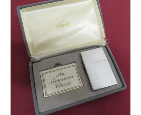 A Zippo 1993 style brushed metal lighter (H6cm), in original case with instructions, etc 