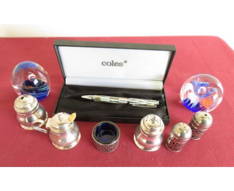 Two Caithness style paperweights, Coles ballpoint pen and a plated cruet 