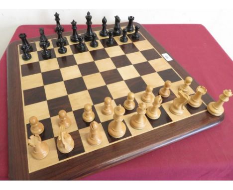 Large turned wooden and ebonised chess set, with weighted bases, on rosewood and satinwood chess board (king H9.75cm) 