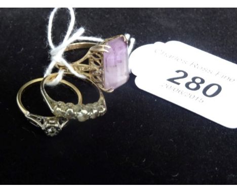 A 9ct gold ring with large purple stone in a claw mount, together with an 18ct gold ring set with single white stone and a fu