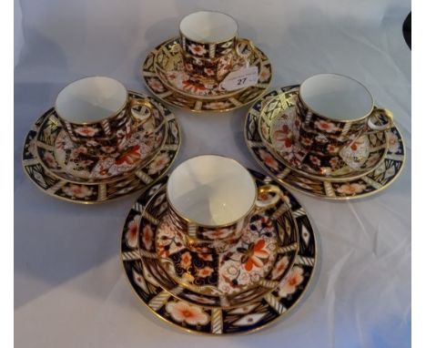 A set of four early 20th century Royal Crown Derby trios, comprising: coffee cup, saucers and side plate, pattern 2451, vario