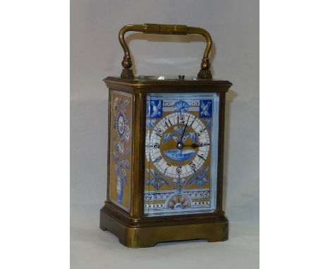 A late 19th century three coil striking brass and enamel carriage clock, the side panels decorated to the aesthetic taste wit