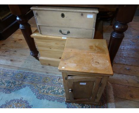 A modern pine child's coffer, together with a pine tool chest and a small pine cupboard.