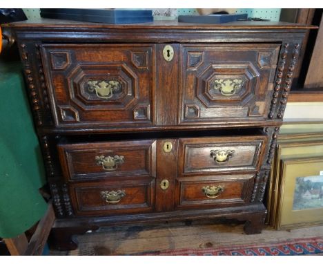 A 19th century and later oak chest, having a moulded bonnet drawer above two other moulded drawers, standing on ogee bracket 
