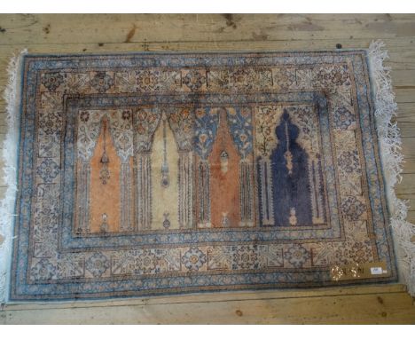 A Turkish Ladik prayer rug, silk, the central panel decorated with four stylized temple interior, bordered by geometric and f