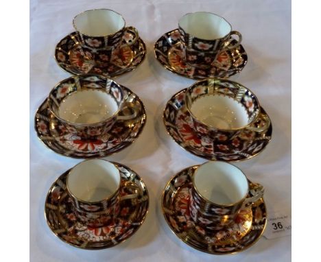 Three pairs of early 20th century Royal Crown Derby Imari cups and sauces, comprising: coffee cup, teacup and coffee cans, pa