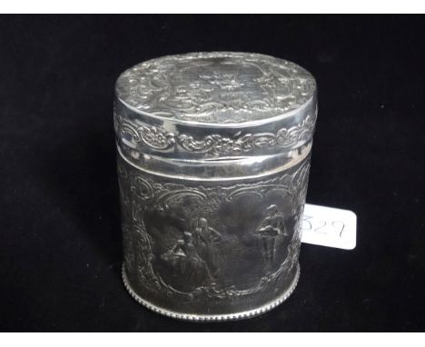 An oval silver tea caddy, decorated with scenes of people at leisure, indistinct marks, 10cm.