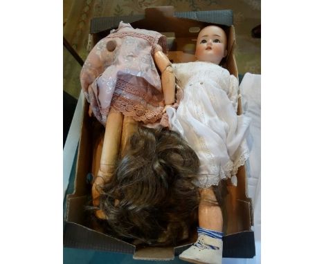 A Schoenau Hoffmeister early 20th century doll, the ceramic head marked SH and dated 1909, together with another composite do