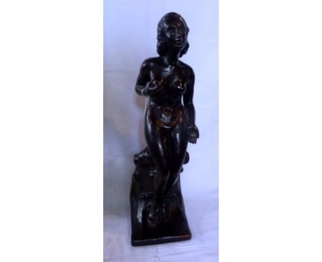 An imposing ceramic Art Deco figure of a nude lady on shaped rectangular base, indistinctly signed, 55cm.