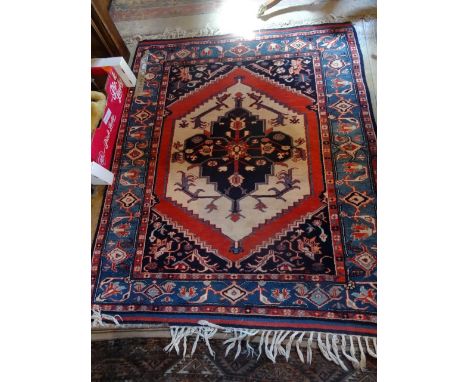 A Turkish Konya rung, typically decorated with stylized floral central panel, surround by Islamic-style forms, 177cm x 143cm.