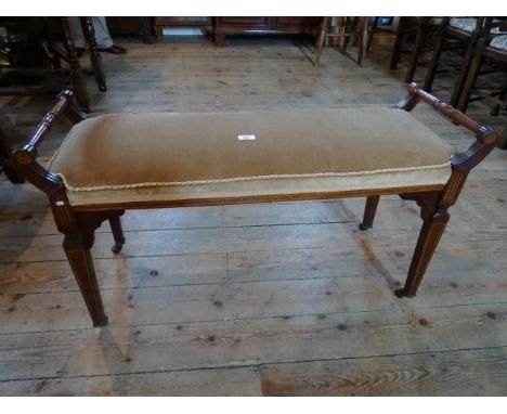 An Edwardian mahogany duet stool, with inlaid decoration and upholstered seat.