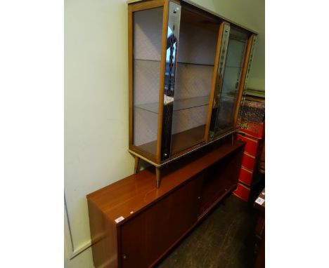 A circa 1950's glass display cabinet with mirrored front panels, together with a later ercol-style sideboard.