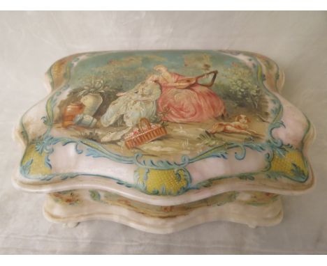 An early 20th century white onyx and painted casket, the lid decorated with a scene of figures in a garden setting, with gard