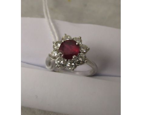 A vintage Kutchinsky 18ct white gold fine ruby and diamond cluster ring